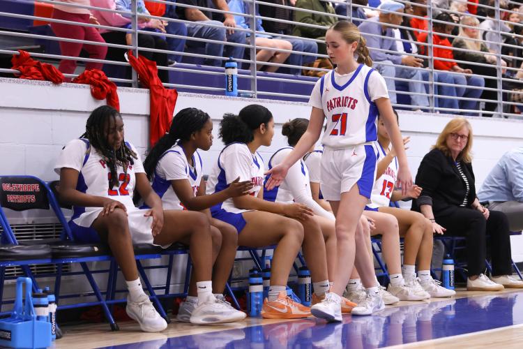 Oglethorpe County player Georgia Turner highfives teammates on Feb. 10. The Patriots lost to the Blue Devils with a score of 40-58. (Photo/Addison Simmons)