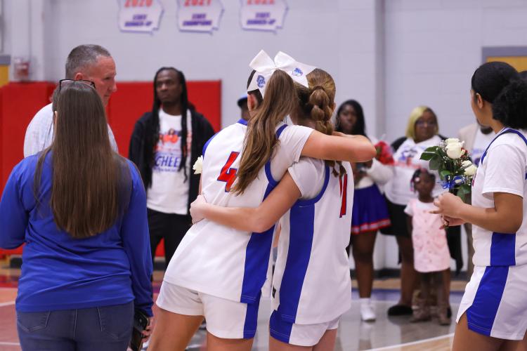 Oglethorpe County player Elin Turner hugs Georgia Turner on Feb. 10. The Patriots lost to the Blue Devils with a score of 40-58. (Photo/Addison Simmons)