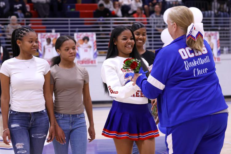 Krysten Jones accepts flowers at the Oglethorpe County High School gymnasium on Feb. 10. The Patriots honored their seniors during their game against Elbert County. (Photo/Addison Simmons)