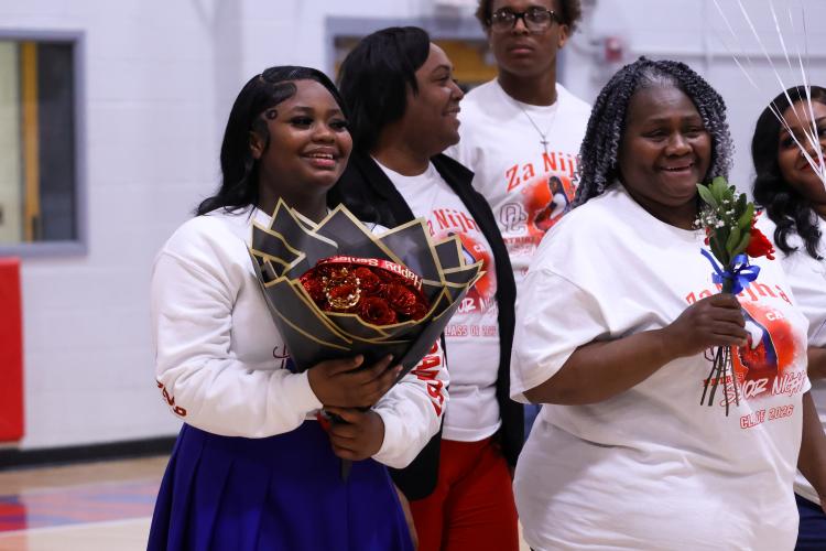 Za'Nijha Carter smiles with flowers at the Oglethorpe County High School gymnasium on Feb. 10. The Patriots honored their seniors during their game against Elbert County. (Photo/Addison Simmons)