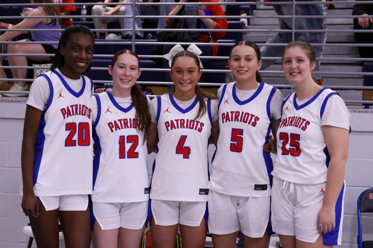 Oglethorpe County highschool seniors Jaliyah Turner, Carlie Gabriel, Elin Turner, Marin Sampson and Ansley Paul pose for a photo at the Oglethorpe County High School gymnasium on Feb. 10. The Patriots honored their seniors during their game against Elbert County. (Photo/Addison Simmons)