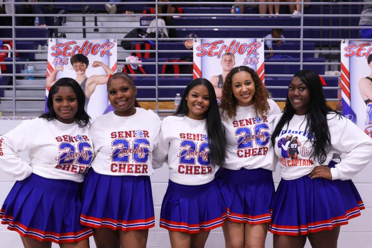 Oglethorpe County highschool senior cheerleaders Za'Nijha Carter,  Ambreia Kelley, Krysten Jones, Kendall Ogle and Tori Clark pose for a photo at the Oglethorpe County High School gymnasium on Feb. 10. The Patriots honored their seniors during their game against Elbert County. (Photo/Addison Simmons)