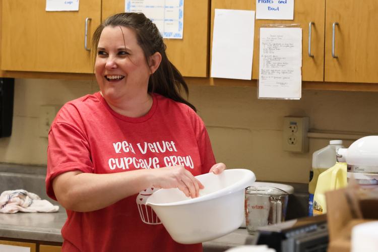 Jill Kort smiles while baking cupcakes for the CAYA House's annual Valentine's Day fundraiser on Friday, Feb. 13, 2026, in Lexington, Georgia. Kort is a core component of the fundraiser, along with Becky Soto, with whom Kort runs CAYA House. (Photo/Sydney Shankman)