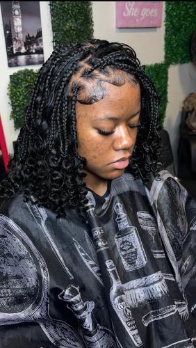 Taloria Clark completes Bohemian two-strands on locs for a client at Queens Beauty Bar in Winterville. Clark has been doing hair since she was 11-years-old. (Photo Submitted)