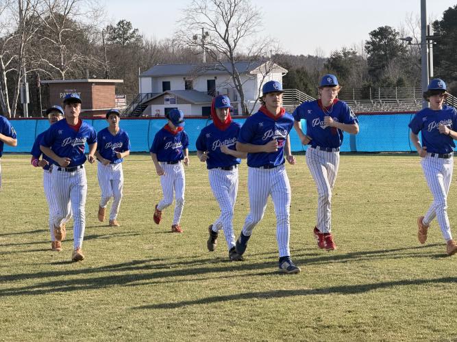 The Patriots warm up on the field before facing Georgia School for Innovation and the Classics (GSIC) at TY Harris Field on Feb. 12. The Patriots look to improve upon an 8-22 season. (Photo/Nicholas Eriksen)