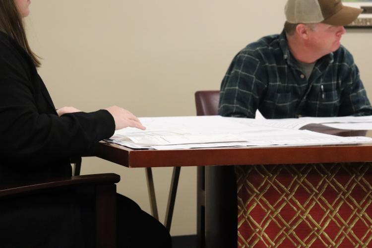 Morgan Robinson, a zoning board member, reviews agenda items and county zoning maps Feb. 12 at the Oglethorpe County Board of Commissioners office. Robinson was filling in for Chair Janet Hill, who attended the meeting virtually on Zoom. (Photo/Emilie Sullivan Oglethorpe Echo)