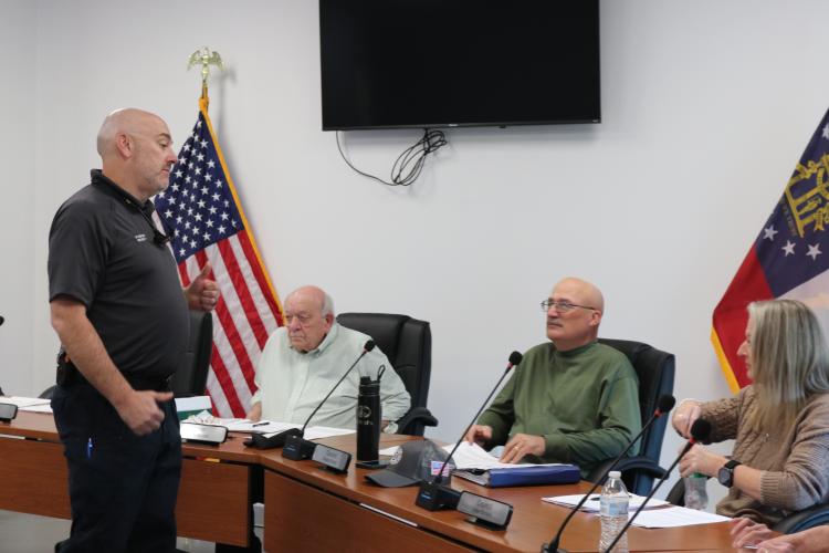 Arnoldsville Fire Chief Heath Baker gives a report to members of the Arnoldsville City Council during its meeting on March 19. The department plans to build an addition to the station. (Photo/Jessie Isaacs)