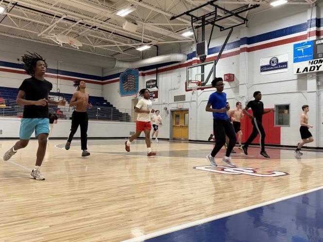 OCHS boys track and field doing drills at a practice on Feb. 26, 2025 in the school's basketball gym. The Patriots have won four of their past five regional meets. (Photo/Nicholas Eriksen)