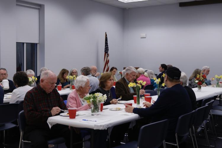 Attendees enjoy a potluck dinner ahead of the Historic Oglethorpe banquet and award ceremony on Feb. 27.  (Photo/ Mia Tanner)