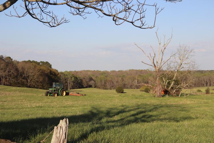 A tractor sits in a field along 202 Bowen Farm Road in Oglethorpe County, Georgia, on March 23, where the proposed cell tower site is under consideration. (Photo/Emilie Sullivan)