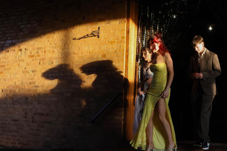 Alexis McBride, Aurora Hendrix and Dove Patrick walk to a table during Oglethorpe County high school prom at Smithonia Farm in Colbert, Georgia on Saturday, April 18, 2026. (Photo/Addison Simmons)
