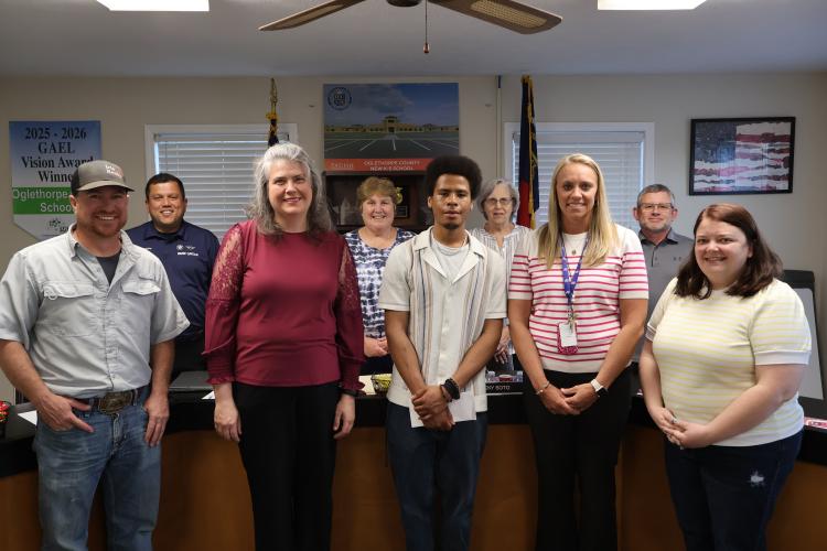 Jake Wilcox (left), Guillermo Camacho, Jennifer Yauck, Beverley Levine, Kayden Watkins, Susan Robinson, Lauren Carlson, Tim Poole and Becky Soto pose for a photo at the BOE meeting on April 14, 2026. Watkins and Yauck were recognized as STAR student and teacher in the BOE meeting on April 14, 2026. (Photo/Jasmine Milbourne)