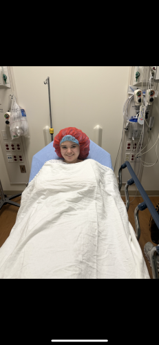 Macie McDaniel is prepped for brain surgery at the University of North Carolina in December 2024. Despite the smile, McDaniel and her mom waited four hours for the procedure. (SUBMITTED PHOTO)