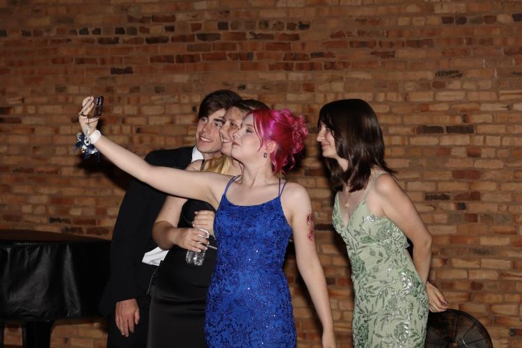 Students pose for selfies at the Oglethorpe County High School prom. (Photo/Mia Tanner)