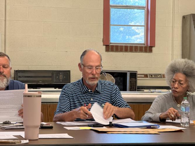 Maxeys Mayor Edward Toledano and council member Shirley Callahan review documents during the city’s April meeting on April 14 at Maxeys City Hall. (Photo/Riley Baugh)