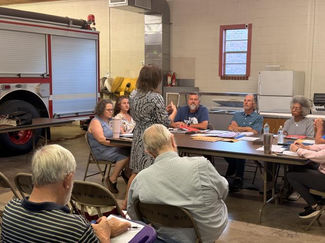 Georgia Municipal Association member services consultant Sherri Bailey speaks to Maxeys Mayor Edward Toledano (center) and the city council at Maxeys City Hall on April 14. She outlined the organization’s role in supporting cities in various ways. (Photo/Riley Baugh)