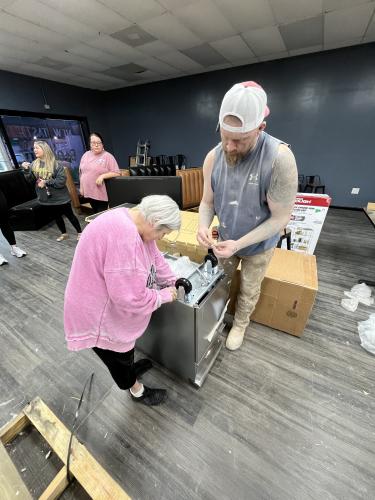 Brenda Butler and Travis Hill put together applicances for The Local Spot. The new Crawford restuarant is planning to open in April. (Photo Submitted)