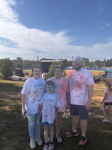 Allison Kitchen, Henry Kitchen, Kelli Kitchen and Andrew Kitchen after participating in the OCHS National Honor Society Color Fun Run on April 25, 2026. Families from the community participated in the Color Fun Run together. (CHARLOTTE/THE OGLETHORPE ECHO)
