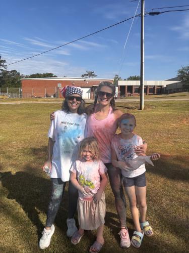 Kala McNair, Kennedy McNair, Eleanor McNair and Panda Jones show their colors after participating in the OCHS National Honor Society’s annual Color Fun Run on April 25. This year’s event raised funds for the Madison Oglethorpe Animal Shelter. (CHARLOTTE COCHRAN/ THE OGLETHORPE ECHO)