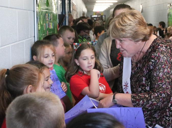Beverley Levine, who is retiring as superintendent of the Oglethorpe County School System, chats with students during a rally in the halls of Oglethorpe County Elementary School in 2022. She said the students are the reason why she devoted so much time and energy to her job. (Katie Tucker/The Oglethorpe Echo)