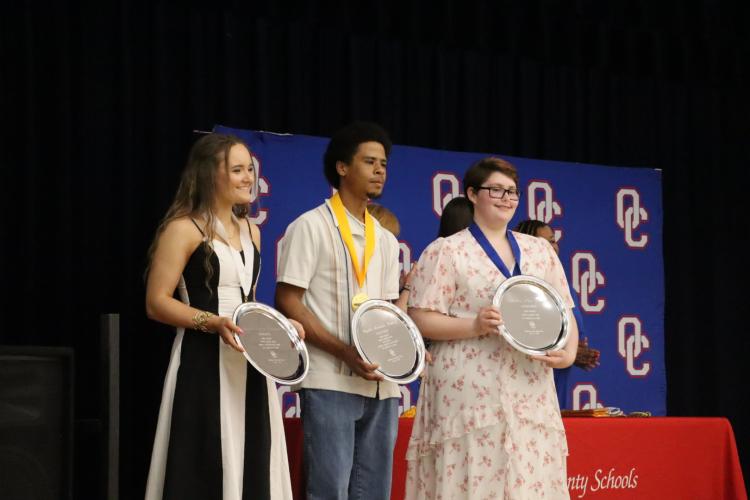 Callie Bridges (from left), the honorian, Kayden Watkins, the salutatorian, and Amber Tiller, the valedictorian, received trophies for their academic achievements at Oglethorpe County’s Senior Honors Night on Tuesday. Tiller is heading to Georgia Tech. (Ellie English/The Oglethorpe Echo)