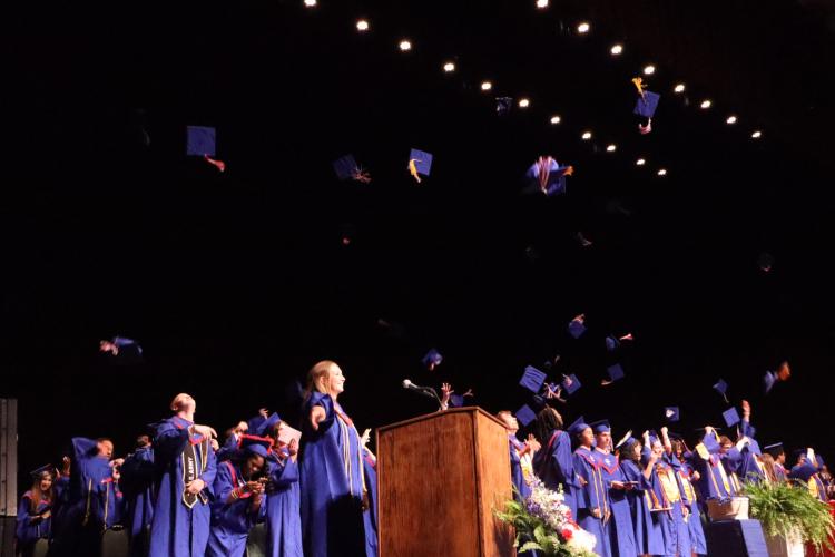 Emilee Cutsail and other Oglethorpe County High School graduates throw their caps into the air, marking the end of the ceremony at The Classic Center in Athens last Friday. The ceremony was moved from Patriot Stadium because of the threat of rain. (Ellie English/The Oglethorpe Echo)
