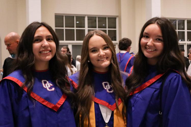 Karolina Jorge (from left), Callie Bridges and Lyndi Casper enjoy the moments after graduating at The Classic Center last Friday. About 2,075 people attended the ceremony in Athens. (Ellie English/The Oglethorpe Echo)