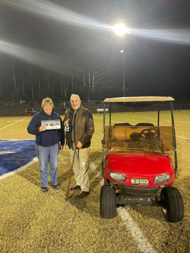 Oglethorpe County School Superintendent Beverley Levine gave Ralph Maxwell Jr. a golf cart to use during OCHS football games. (Submitted Photo)