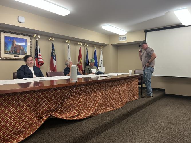 From left, zoning board members Morgan Robinson, Jimmy Shealy and Sam Nash, along with Planning Director Jeff Sharp, prepare for the April 16 zoning board meeting. Board member JF Hansford was absent. During the meeting, the board approved multiple zoning and land-use requests, including a proposal for a wedding venue and updates to county solar battery regulations, while denying one subdivision variance request. (Photo/Emilie Sullivan)