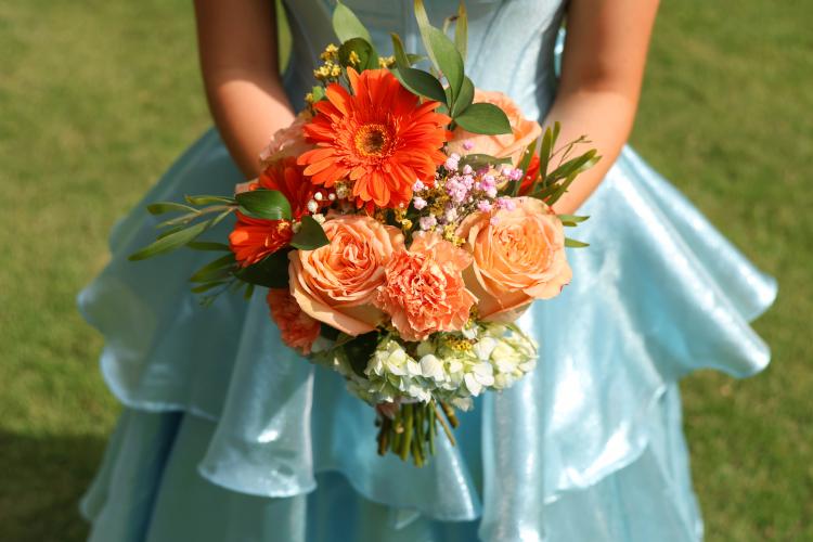 Andee Dellinger holds a bouquet of flowers in Oglethorpe County on Saturday, April 18, 2026. Dellinger made her bouquet of flowers herself. (Addison Simmons/The Oglethorpe Echo)
