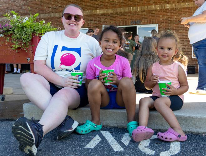 Chelsea Smith, left, poses with her daughters, Paisley, middle, and Harper at Oglethorpe Children's Academy OCA's 20th anniversary celebration in Crawford on Friday. Paisley and Harper both attend OCA. (Ethan Greene/The Oglethorpe Echo)