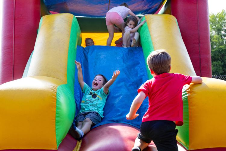 Children enjoy playing on an inflatable slide at Oglethorpe Children's Academy 20th anniversary celebration in Crawford on Friday. The center opened in 2006 and is the county’s only daycare center. (Ethan Greene/The Oglethorpe Echo)