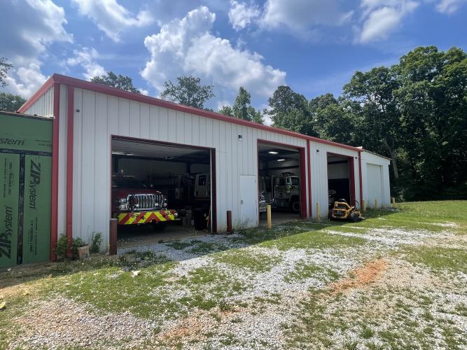 The existing bay of the Arnoldsville Fire Department, which currently houses four trucks. A side building is being added onto the bay to provide the volunteer firefighters with more space and serve as a refuge for community members during severe weather. (Lexie Shadix/The Oglethorpe Echo)