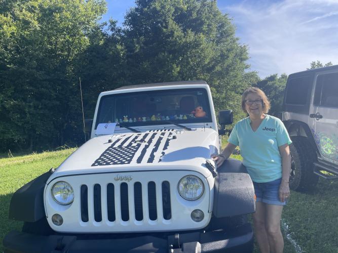 Carol Eidson stands next to her 2016 Jeep Wrangler during Town and Country Kafe's Jeep Invasion. Eidson's vehicle was voted Best Original Jeep. (Lexie Shadix/The Oglethorpe Echo)