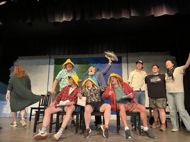 The cast of “Come From Away” rehearses a scene while on stage at the Historic Crawford School on June 11. Like in the original Broadway version, rows of chairs are used to simulate rows of seats on an airplane during the story that takes place during Sept. 11, 2001. (Sarah Nanos/The Oglethorpe Echo)