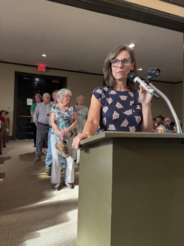 McKay Crowley, who lives on Old Edwards Road, speaks to the Oglethorpe County commissioners as a line of residents forms behind her. Seventeen residents spoke out against a 25-home development on Yancey Road that was denied on Monday. (Andy Johnston/The Oglethorpe Echo)