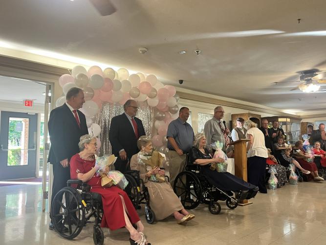 Quiet Oaks pageant contestants, including from left Mary Ellen Smith, Frankie Brooks and Rachel Lowry, wait as the final titles are given out at the end of the event on June 4. All contestants who participated in the pageant received a title, flowers and a gift basket. (Sarah Nanos/ The Oglethorpe Echo)