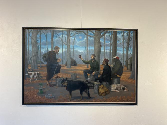 Terry Rowlett's painting features four men and three dogs sitting around a campfire in the woods. All of the figures featured in the work were personally connected to Rowlett in real life, and the painting is on display now through June 26 at the Oconee Cultural Arts Foundation. (Sarah Nanos/The Oglethorpe Echo)