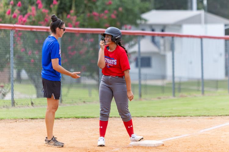 OCHS junior Riley Jones talks with head coach Brianna Dickens during practice at Oglethorpe County High School in Lexington, Georgia, on Monday, July 27, 2026. The Patriots season starts at Baldwin on Aug. 1. (Ethan Greene/The Oglethorpe Echo)