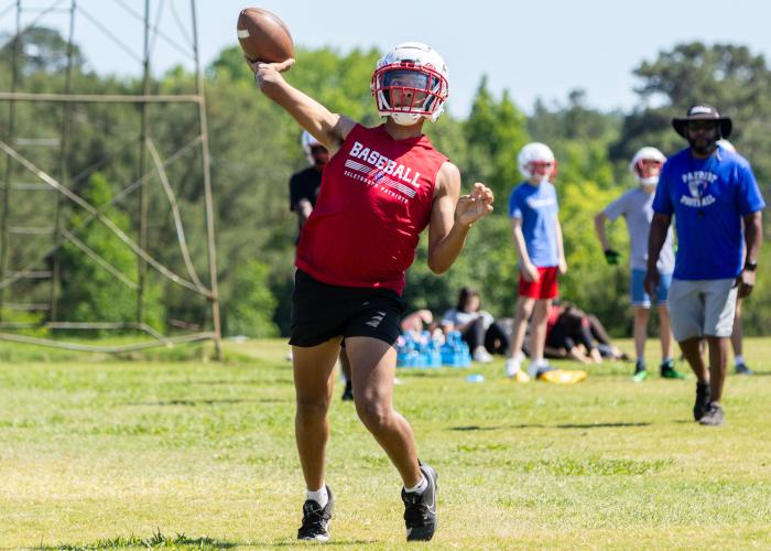 OCHS quarterback Nathan McCalla passes during practice at Oglethorpe County High School in Lexington, Georgia. McCalla is expected to share quarterback duties with junior Justin Wilson this season. (Ethan Greene/The Oglethorpe Echo)