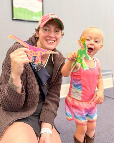 Children and staff show off their dinosaur origami at The Oglethorpe County Library. As a part of the summer reading program, the library has hosted events centered around the theme "Unearth a Story," with many of the events focused on dinosaurs and science. (Submitted Photo)