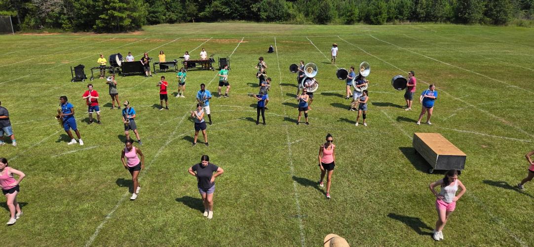 The OCHS marching band goes through its routines during practice earlier this month. The band will perform a show called “Nightmare” during halftimes and competitions this fall. (Submitted Photo)