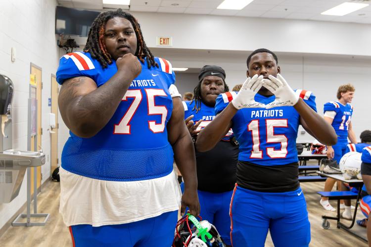 Defensive linemen Sam Bell (75) and Josh Hull (15) goof off during photo day at OCHS earlier this month. Bell is projected to start at nose guard this season. (Ethan Greene/The Oglethorpe Echo)