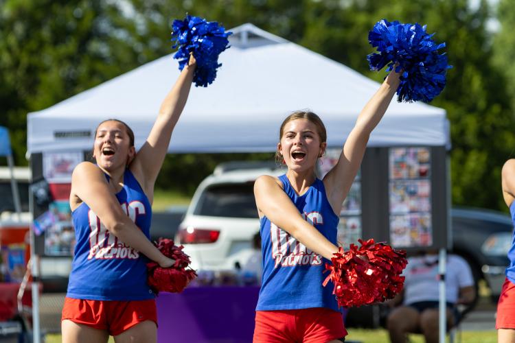 Oglethorpe County cheerleaders Ella Bennett, right, and Alexa Lopez, left, perform during  Oglethorpe County Community Day hosted by Family Connection at Oglethorpe County Middle School in Lexington, Georgia, on Saturday, Aug. 8, 2026. (Ethan Greene/The Oglethorpe Echo)