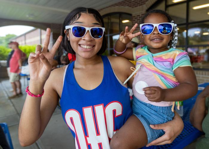 Oglethorpe County cheerleader Takyra Edwards and Loyale Edwards pose for a portrait during Oglethorpe County Community Day hosted by Family Connection at Oglethorpe County Middle School in Lexington, Georgia, on Saturday, Aug. 8, 2026. (Ethan Greene/The Oglethorpe Echo)
