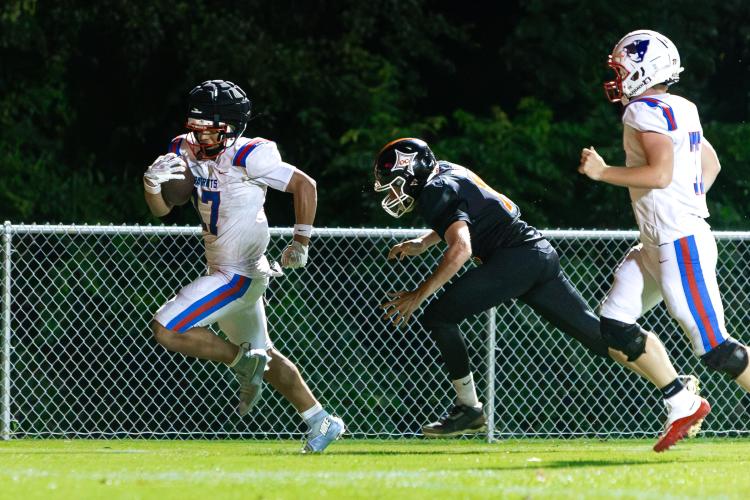 Freshman running back Cooper Davenport scores in Oglethorpe County’s 28-21 victory over Glascock County in a scrimmage last Friday. Davenport is projected to share carries in the Patriots’ deep backfield. (Ethan Greene/The Oglethorpe Echo)