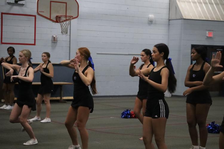 Members of the OCHS cheerleading team practice their routines at the school system’s multipurpose building last week. The team features 12 seniors. (Ellie English/The Oglethorpe Echo)