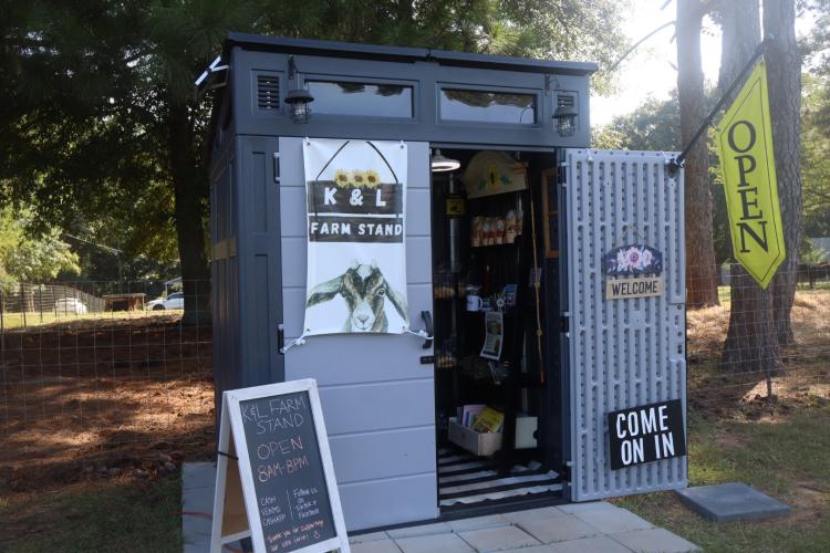 Customers use the honor system to pay for goods at the K&amp;L Farm Stand on Arnoldsville Road in Winterville. Owner Lindsie Moore said the stand is a way of “giving back to our community.” (Ellie English/The Oglethorpe Echo)