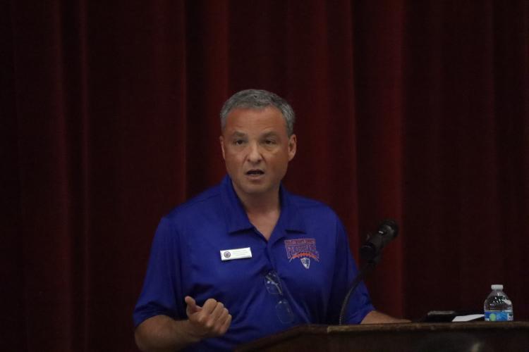 Oglethorpe County Superintendent Phillip Powell speaks to about 33 people at the first Patriot Porch at the OCHS cafeteria on Saturday. He spoke about several topics, including the budget and chronic absenteeism. (Ellie English/The Oglethorpe Echo)
