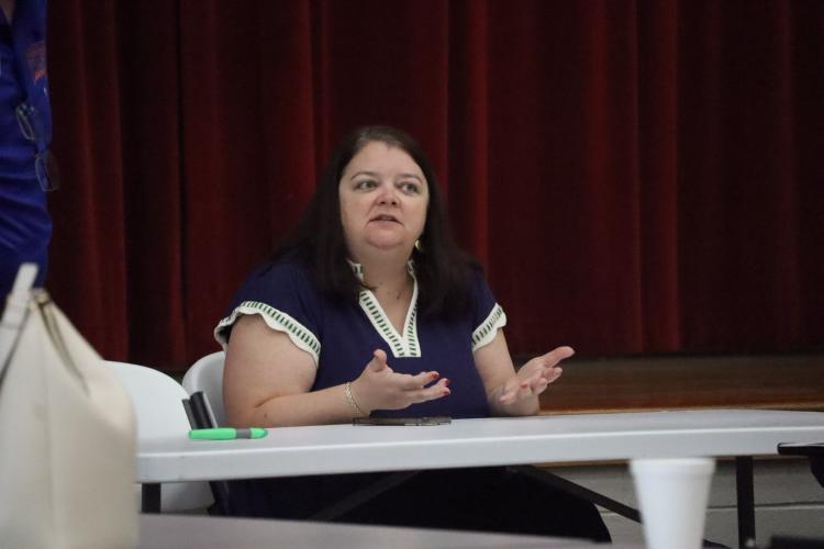 Oglethorpe County Board of Education Chair Becky Soto introduces Superintendent Phillip Powell at the Patriot Porch, a time for the community to hear from and chat with Powell. The first one was held Saturday. (Ellie English/The Oglethorpe Echo)